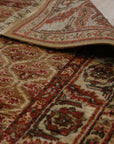 Giselle Zinnia Brown Hand Knotted Wool Rug, warm brown tones and intricate floral patterns lend a cozy elegance to this wool rug, showcasing its hand-knotted construction.