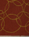 Nadia Lydia Red Flatweave Wool Rug displayed on light hardwood flooring, its vibrant red hue and flatweave construction grounding a minimalist space.