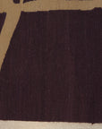 Stylish Iris Purple Flatweave Wool Rug, covering a portion of a light wood floor, its cool purple hues adding a touch of modern elegance to the room.