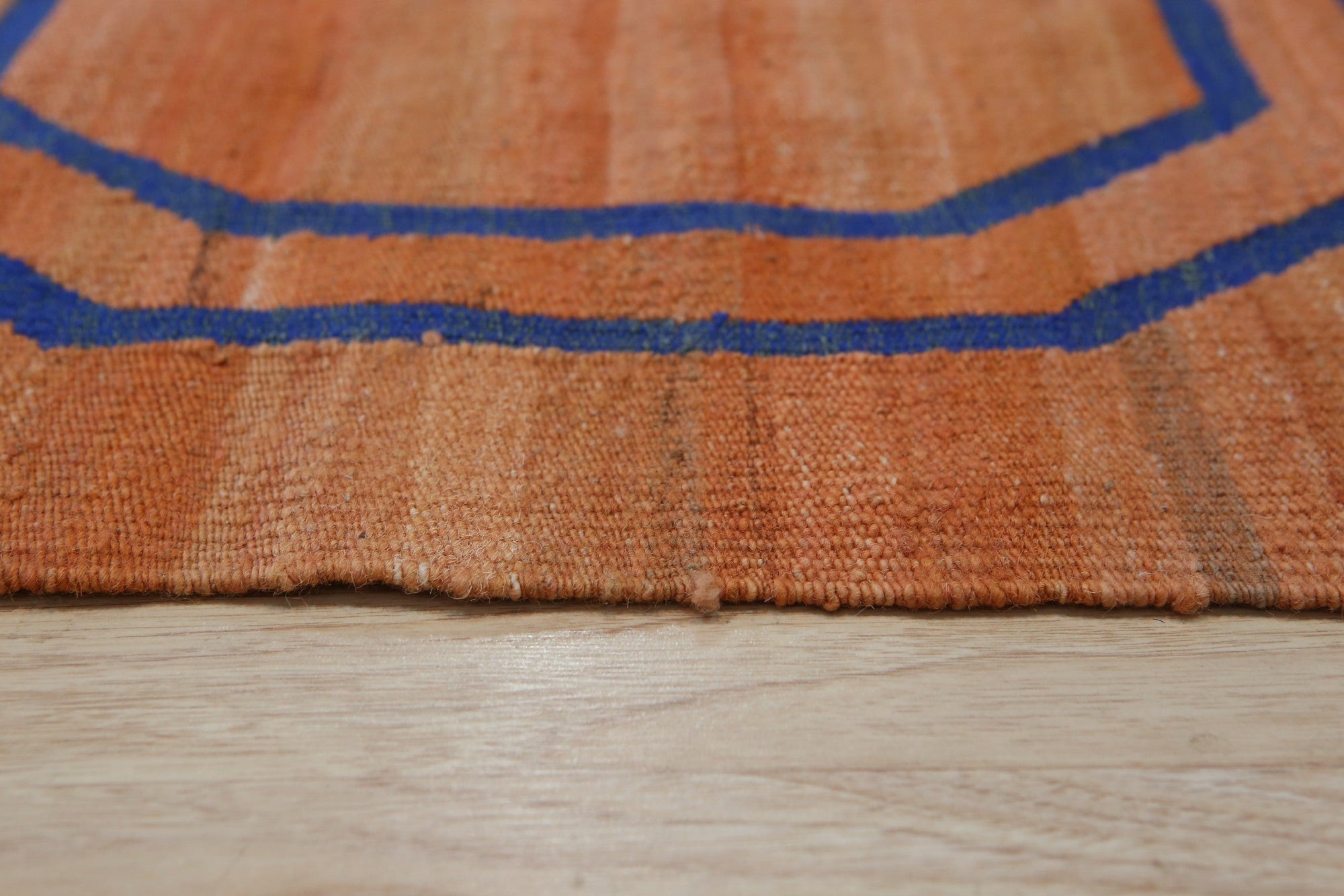 Elena Comfortable Brown Flatweave Wool Rug, a warm brown wool rug with a subtle texture and flatweave construction, displayed in a bright, modern living space.