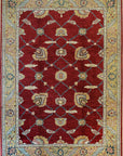 Enchanting Oushak Red Hand Knotted Wool Rug, showcasing its intricate, ornate floral design in rich reds and earthy neutrals against a subtly textured background.
