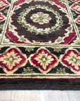 Giselle Violet Red Hand Knotted Wool Rug, showcasing a vibrant blend of violet and red hues in a hand-knotted wool construction, seen in a well-lit room setting.