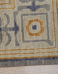 Giselle Exquisite Beige Hand Knotted Wool Rug, warm beige tones and intricate hand-knotted texture soften a modern living space with light wood furniture.