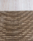 Sloane Freya Brown Hand Tufted Wool Rug, textural waves of deep brown and creamy beige ripple across this hand-tufted wool rug, adding warmth and organic modern style to a living space.