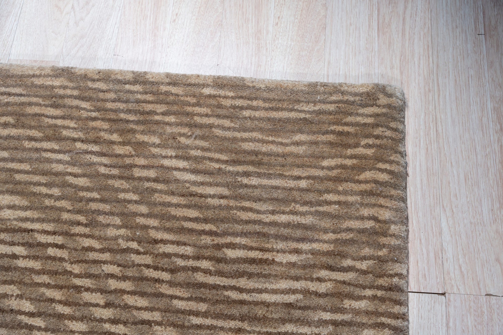 Sloane Freya Brown Hand Tufted Wool Rug, warm brown tones and subtle texture inviting touch, grounds a bright, modern living space with a woven depth.