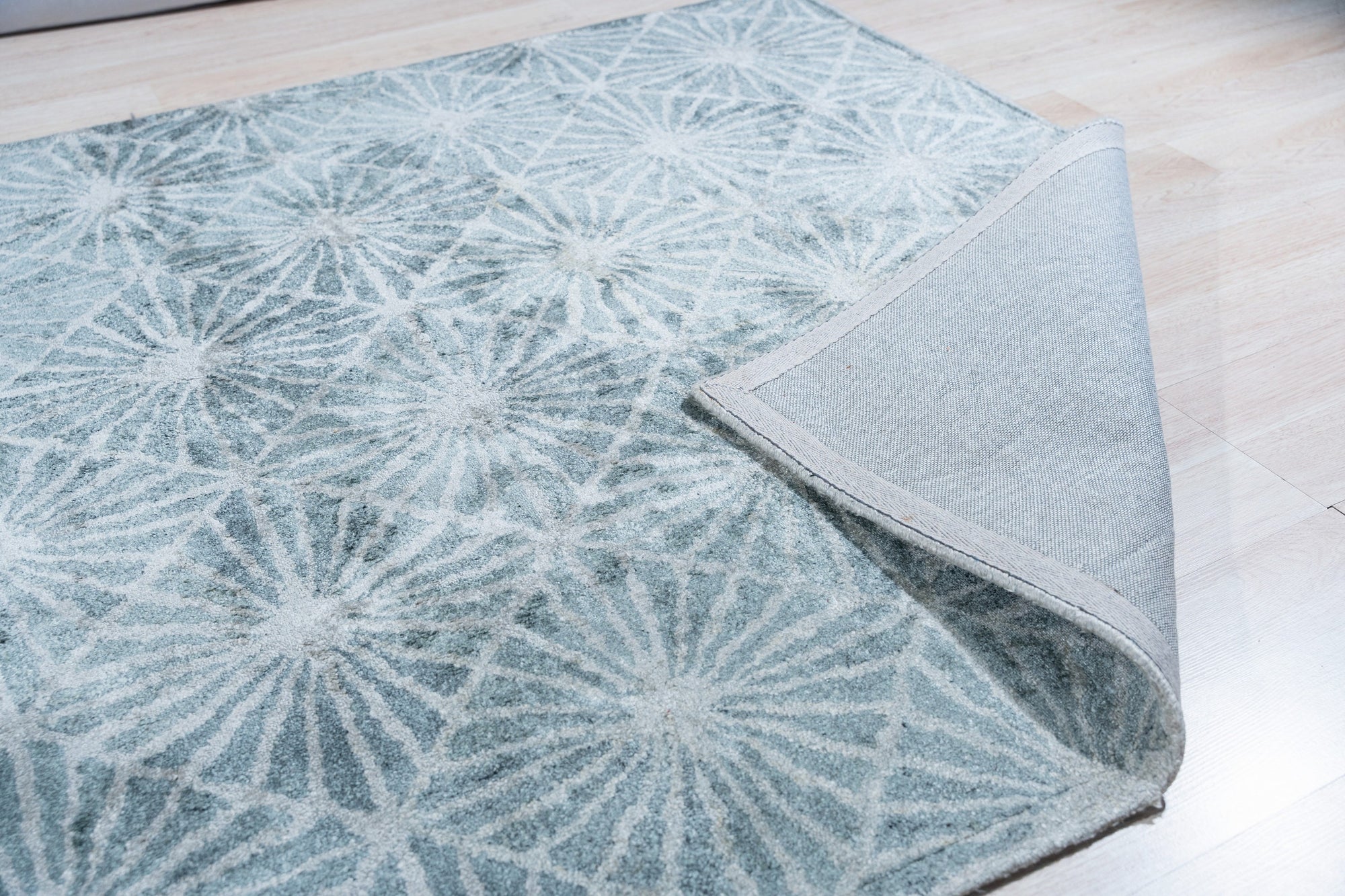Versatile Yara Ivory Hand Tufted Wool Rug, soft ivory wool underfoot, textured hand-tufted construction, lending warmth and subtle pattern to a modern living space.