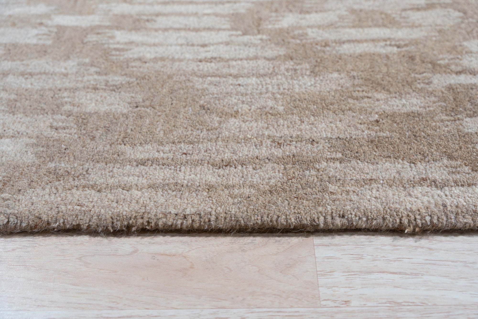 Vibrant Alluring Beige Hand Tufted Wool Rug, its luxurious pile and subtle beige hues enriching a modern living space.