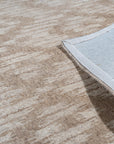Vibrant Alluring Beige Hand Tufted Wool Rug, a beige wool rug with a textural, potentially geometric design, seen in a bright, modern living space.