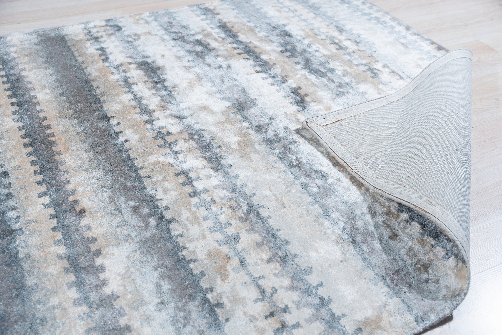 Selene Stylish Multicolored Hand Tufted Wool Rug, bursts with vibrant hues across a living room floor, its hand-tufted wool creating a soft texture beneath a modern coffee table.