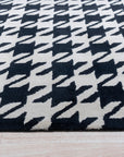 Inviting Timeless Black, White Hand Tufted Wool Rug, seen in a well-lit living room setting; a black and white wool rug with a geometric design adds a modern touch to the space.