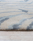 Vibrant Dahlia Beige Hand Tufted Wool Rug, showcasing intricate floral patterns in beige, cream, and subtle earth tones, bringing warmth and texture to a living space. Hand-tufted wool construction adds luxurious comfort and durability.