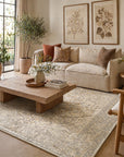 Warm Bespoke Beige Hand Tufted Wool Rug in a cozy living room with cream linen sofa, oak coffee table, and botanical prints - lifestyle photo