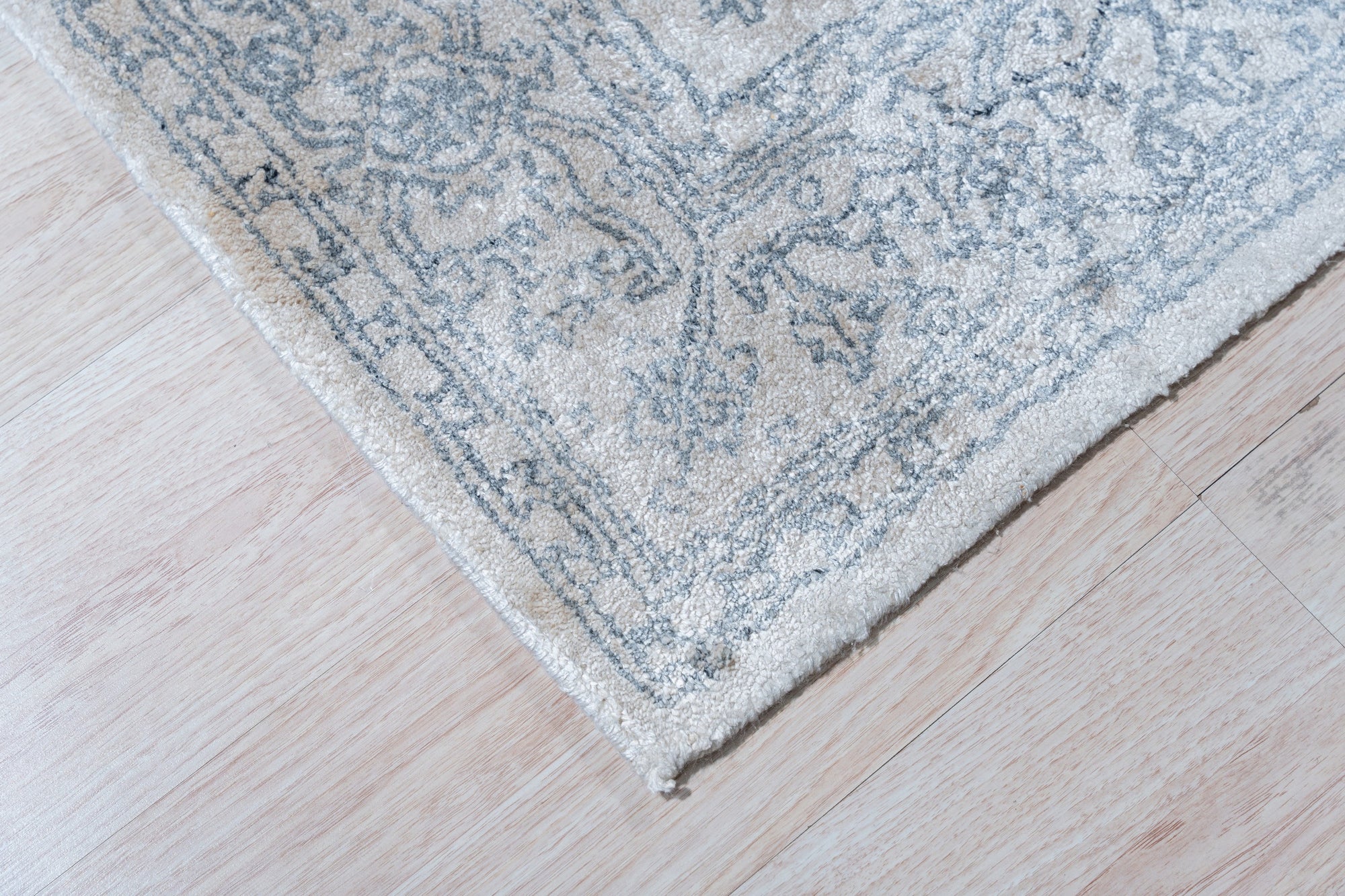 Warm Bespoke Beige Hand Tufted Wool Rug, inviting warmth radiates from soft, hand-tufted wool, its neutral beige tone complementing a modern living space.