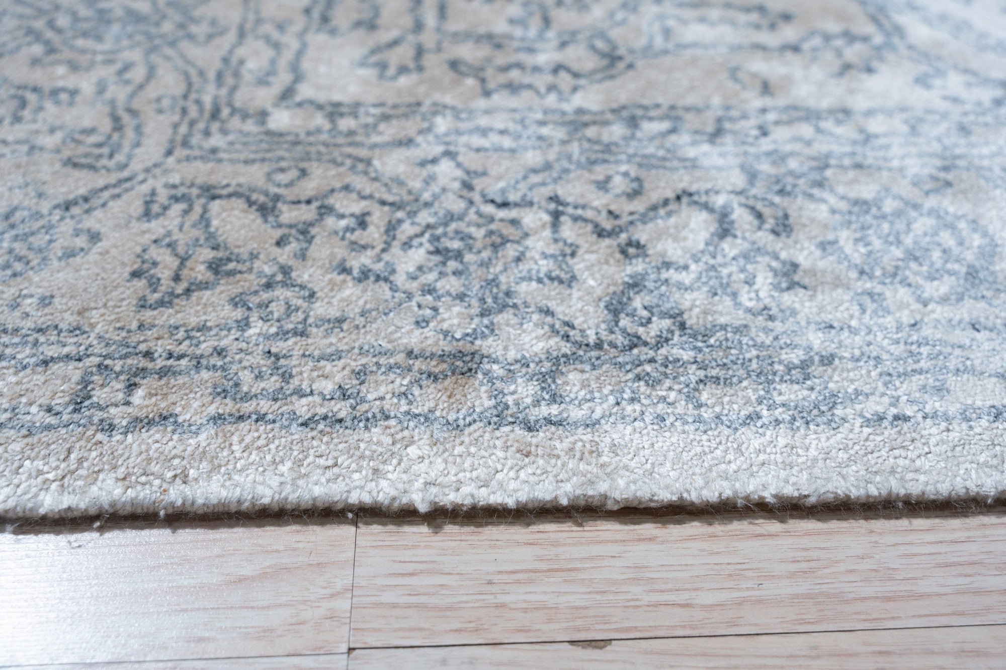 Warm Bespoke Beige Hand Tufted Wool Rug softening a modern living space, its plush beige wool pile adding warmth and texture to the room.