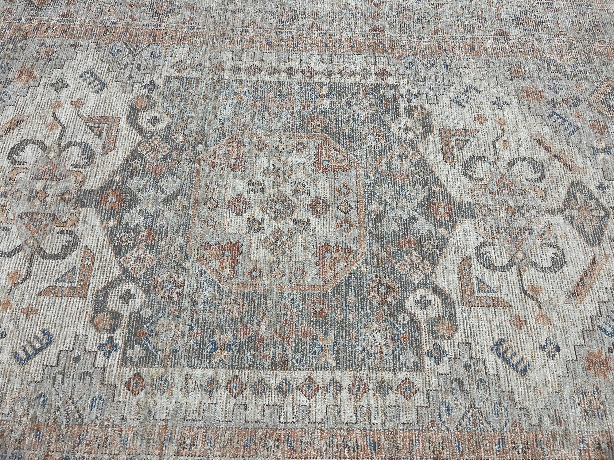 Fiona Vibrant Ivory Handmade Wool Rug, its creamy ivory wool pile creating a soft, inviting texture and subtle pattern variation under warm light.