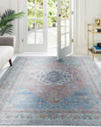 Refined Fiona Blue Handmade Wool Rug, a deep blue wool rug with an intricate, subtly patterned design, laid on a dark hardwood floor.