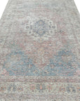 Refined Fiona Blue Handmade Wool Rug: soft, textured wool rug in shades of blue, showcasing intricate hand-knotted details and a subtle, elegant pattern, creating a calming and sophisticated atmosphere.