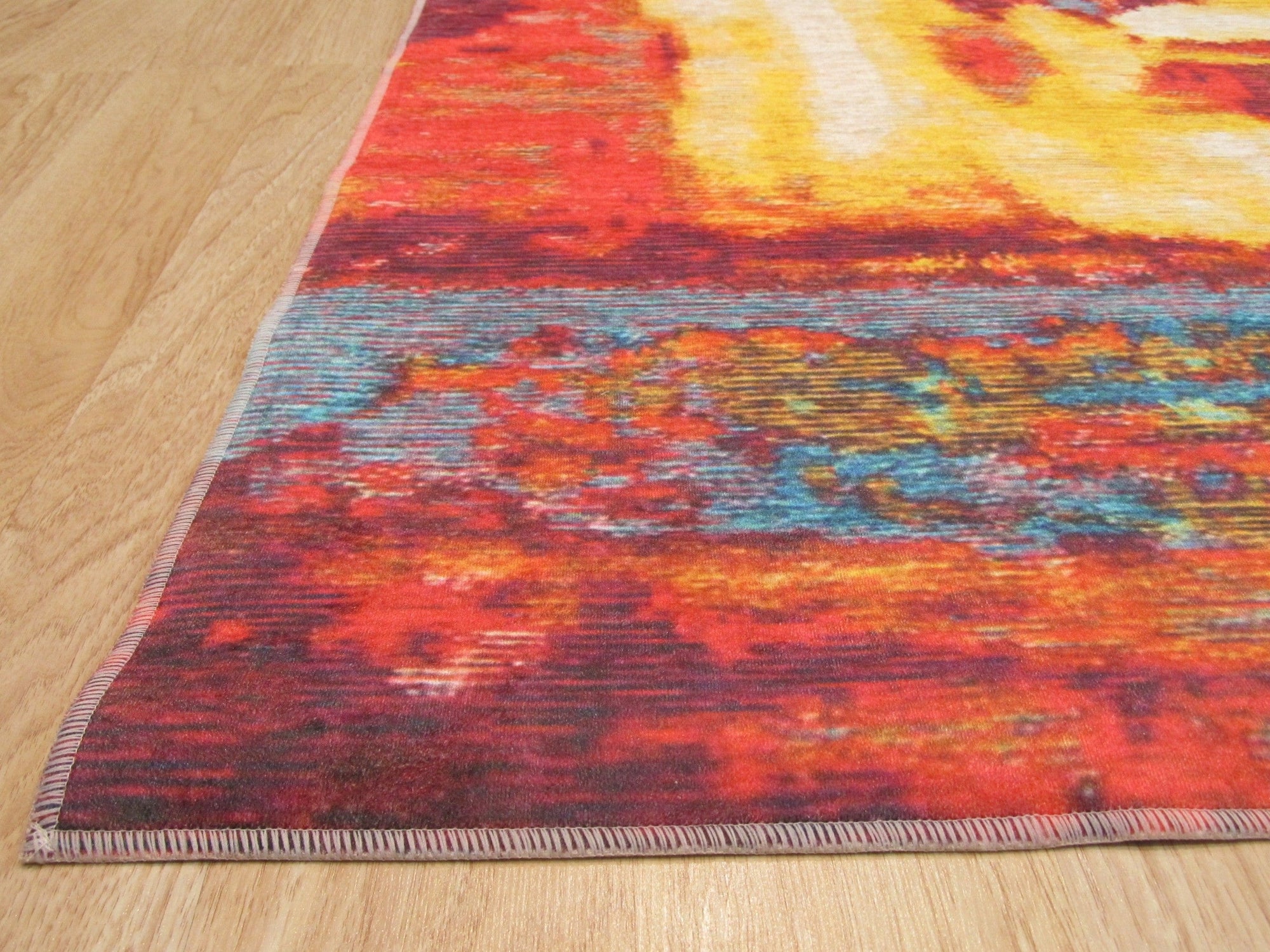 Bianca Isla Red Machine Made Rug: close-up reveals intricate, machine-woven details of the red rug.