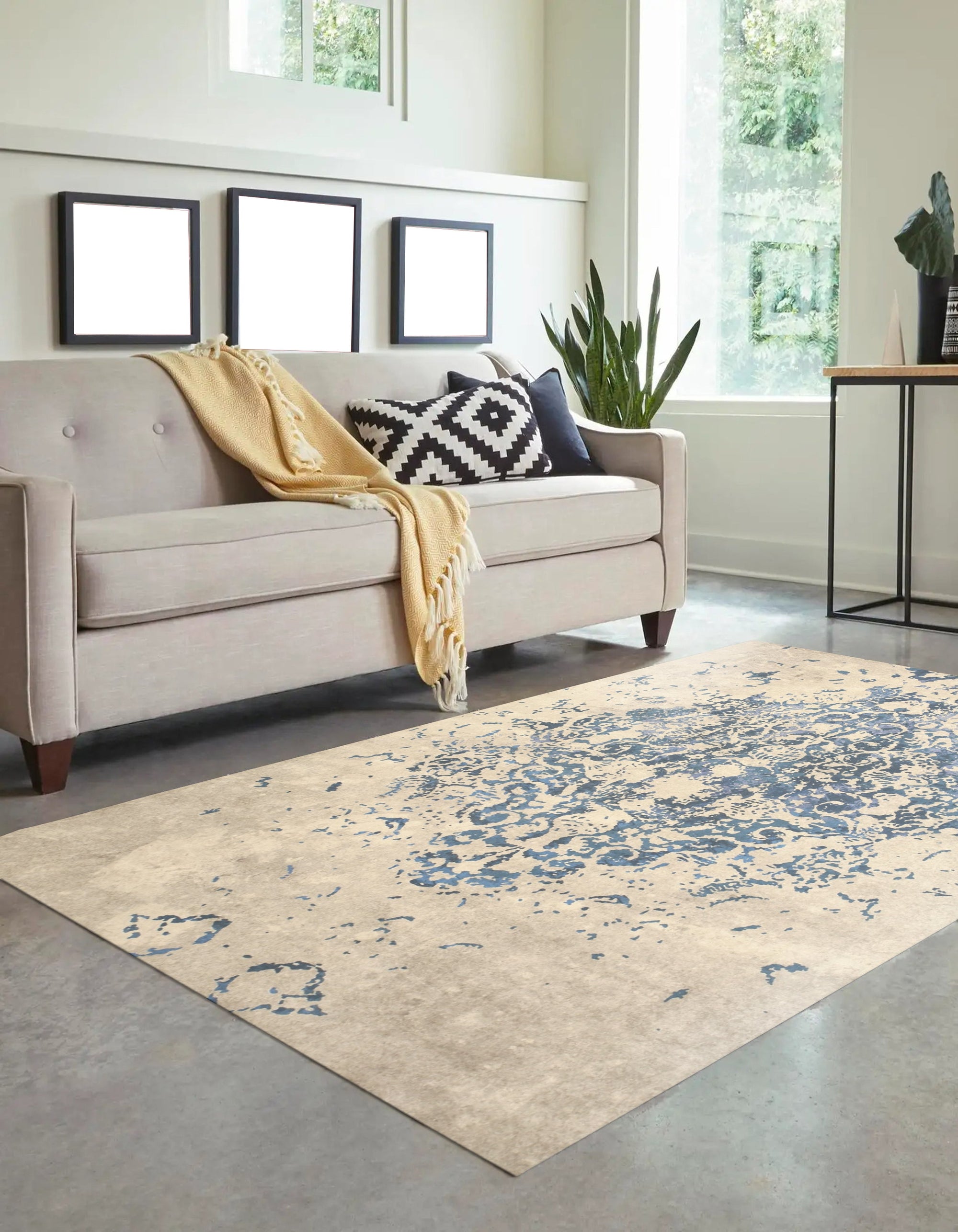 Modern Classic Blue Machine Made Rug, showcasing its intricate patterns and rich blue hues within a living room setting; furniture is thoughtfully arranged around the rug, highlighting its central role in the decor.