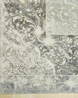 Bianca Warm Gray Machine Made Rug, anchoring a minimalist living room with its subtle warmth; soft gray tones blend effortlessly, offering a plush, inviting feel underfoot.