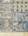 Sarrah Para Ivory Machine Made Rug, blending seamlessly with a light wood floor, showcasing intricate floral patterns and a soft, muted ivory palette within a bright, modern living space.