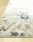 Sophisticated Willow Ivory Machine Made Rug displayed in a bright living room; soft ivory tones and subtle willow-inspired patterns complement the modern furniture.
