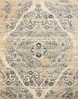 Isolated view of Iris Mira Ivory Machine Made Rug, showcasing its intricate, swirling floral and geometric design in soft ivory tones.
