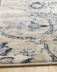 Iris Mira Ivory Machine Made Rug displayed in a bright living room setting, its intricate pattern adding warmth to the neutral decor.