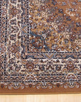 Iris Opulent Rust Machine Made Rug, showcasing a detailed floral pattern in rich rust tones, machine-made construction visible in the tight weave, covering a portion of a warmly lit room.
