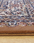 Iris Opulent Rust Machine Made Rug, featuring a complex floral pattern in warm rust tones, sprawls across a light wood floor, suggesting a cozy and inviting living space.