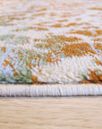 Brenda Lydia Ivory Machine Made Rug displayed in a bright living room, its ivory tones and intricate machine-made design complementing the neutral furniture and warm wood floors.