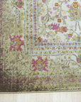 Sophisticated Majestic Ivory Machine Made Rug, a soft ivory rug featuring a subtly textured geometric pattern, lays flat on a light wooden floor, casting a warm glow from unseen overhead lighting.