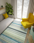 Zinnia Striped Green Handmade Wool Rug laid on light hardwood flooring, showcasing its vibrant green and off-white striped pattern. Handcrafted texture visible in the wool weave.