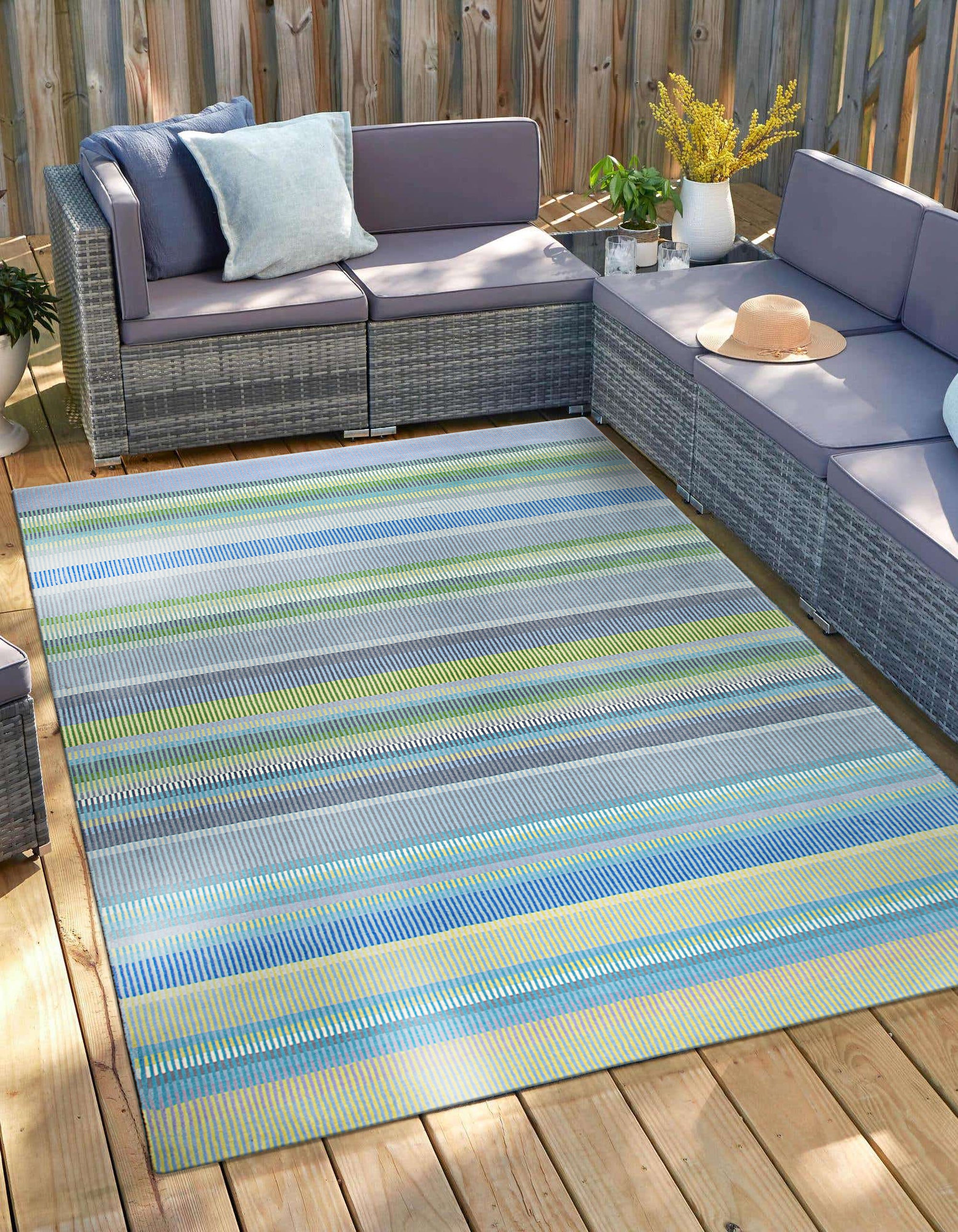 Serene Xena Green Handmade Wool Rug, displaying its lush green tones and intricate handwoven texture, anchoring a bright living room with natural light and complementing modern furniture.