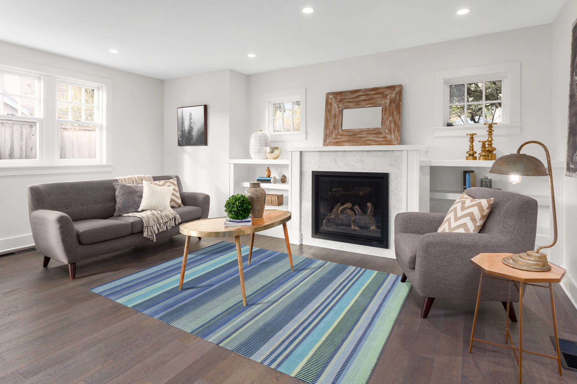 Comfortable Striped Lavender Handmade Wool Rug, a soft lavender and cream striped wool rug handwoven with a plush pile, grounding a light and airy living room with natural light.