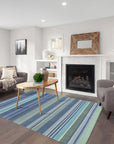 Comfortable Striped Lavender Handmade Wool Rug, a soft lavender and cream striped wool rug handwoven with a plush pile, grounding a light and airy living room with natural light.