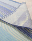 Comfortable Striped Lavender Handmade Wool Rug, soft lavender and cream stripes define this cozy wool rug, adding warmth and subtle color to a modern living space.