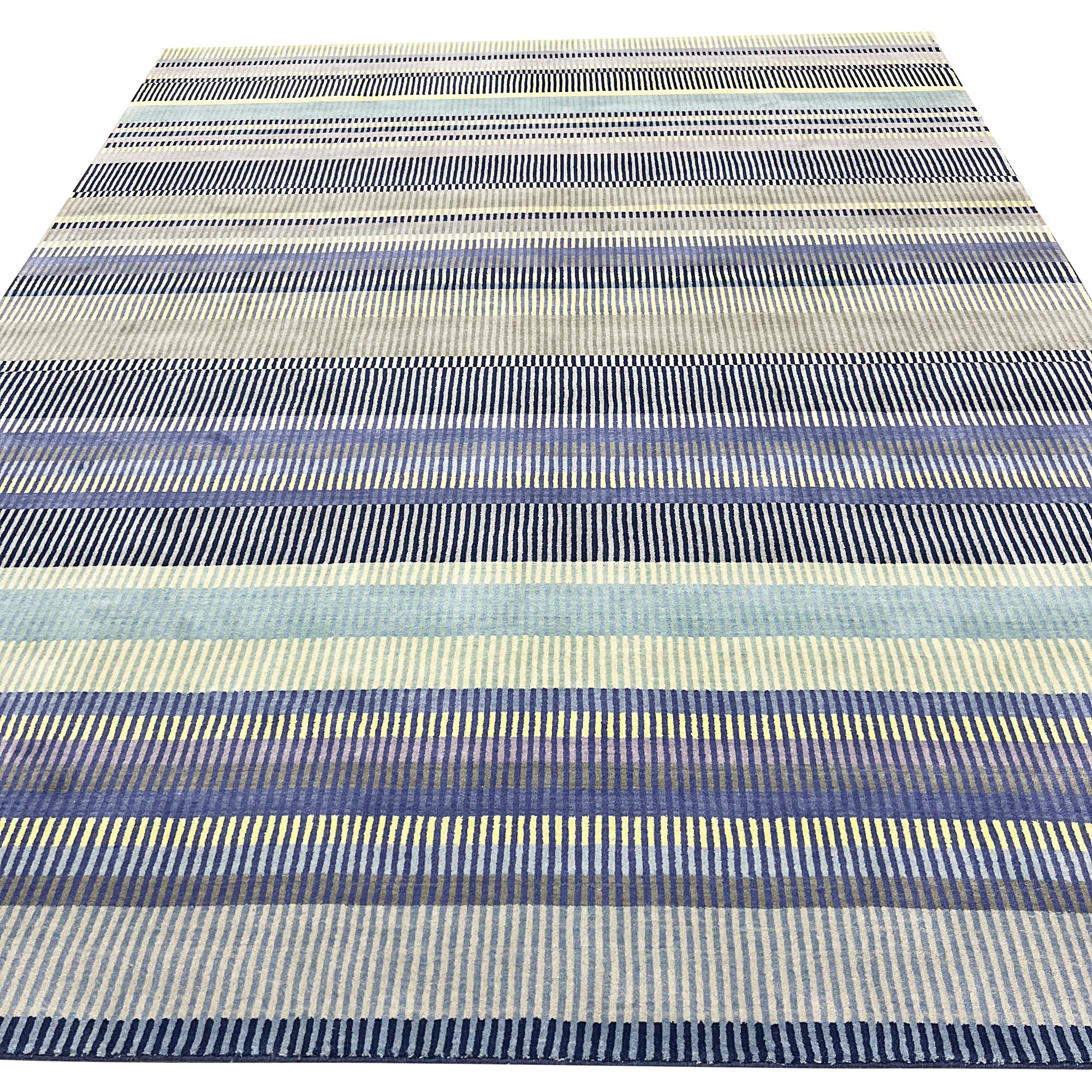 Comfortable Striped Lavender Handmade Wool Rug, soft lavender and cream stripes define this hand-woven wool rug, adding a touch of serene elegance to a brightly lit living space.