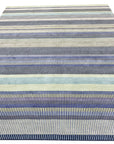 Comfortable Striped Lavender Handmade Wool Rug, soft lavender and cream stripes define this hand-woven wool rug, adding a touch of serene elegance to a brightly lit living space.