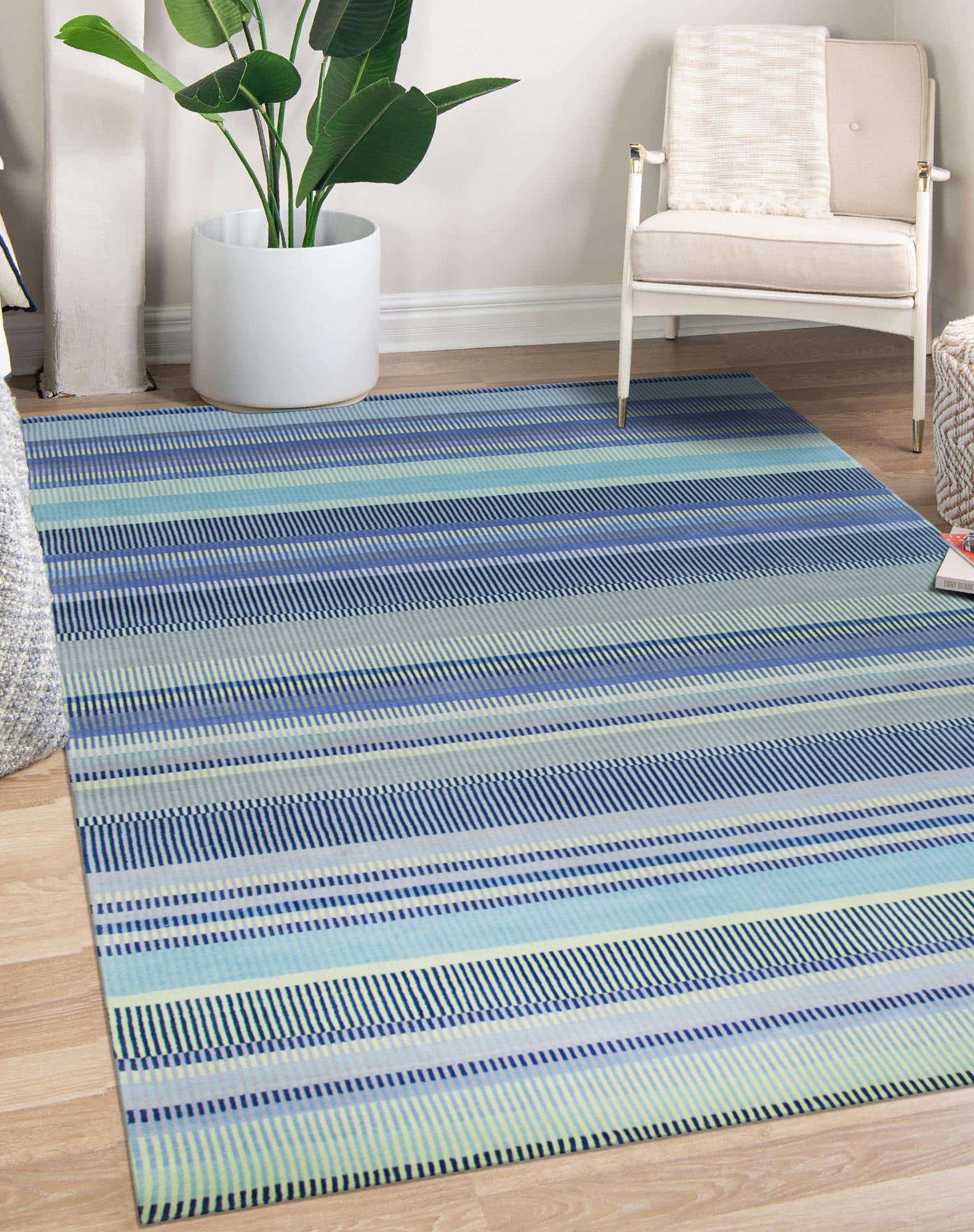 Comfortable Striped Lavender Handmade Wool Rug displayed in a well-lit living room setting; showcases the rug's soft texture and subtle lavender stripes harmonizing with neutral furniture, illustrating its potential to add warmth and style to home decor.