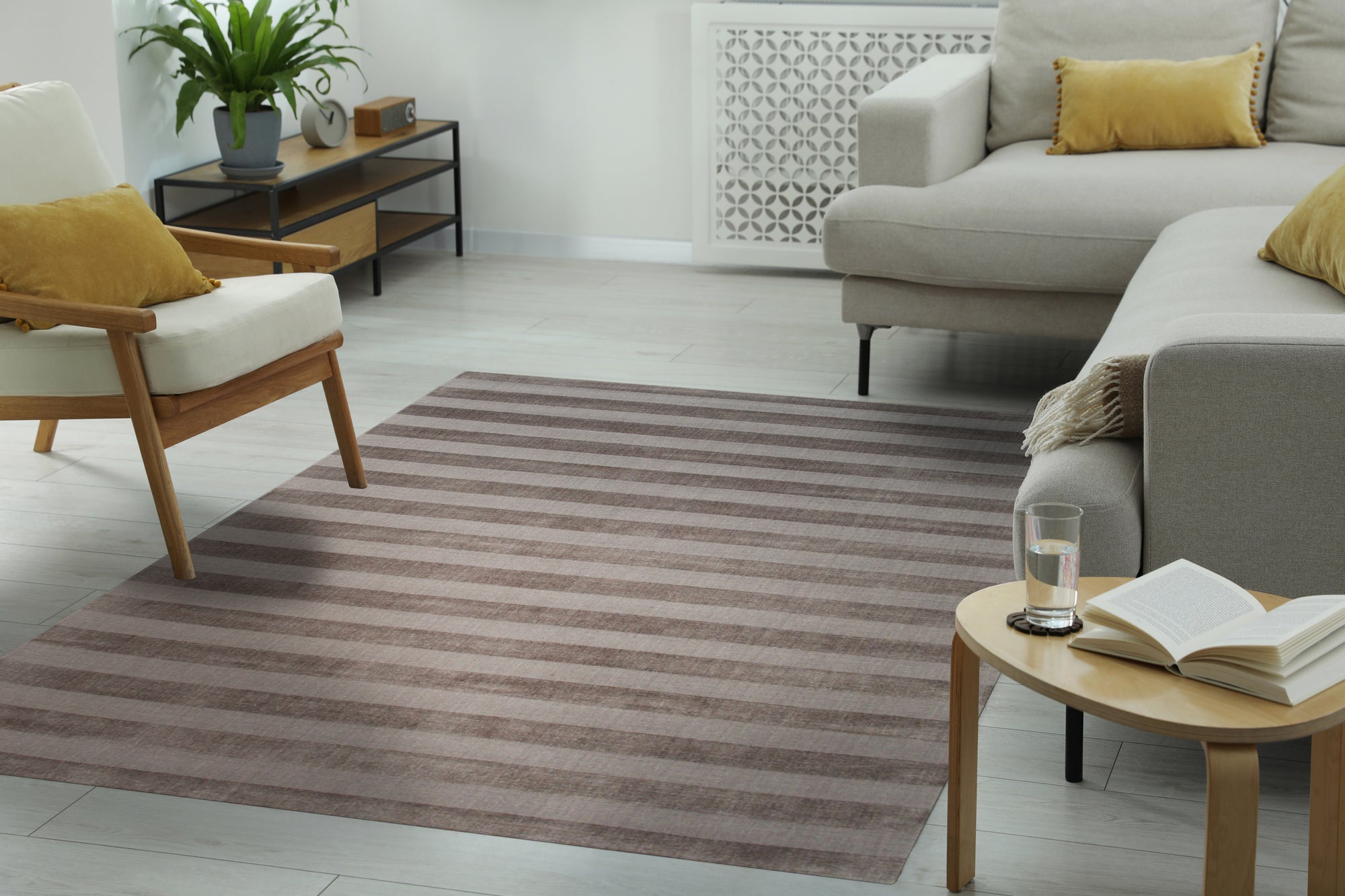 Yara Alluring Brown Handmade Wool Rug, its warm brown tones and subtle texture enriching a modern living room setting.