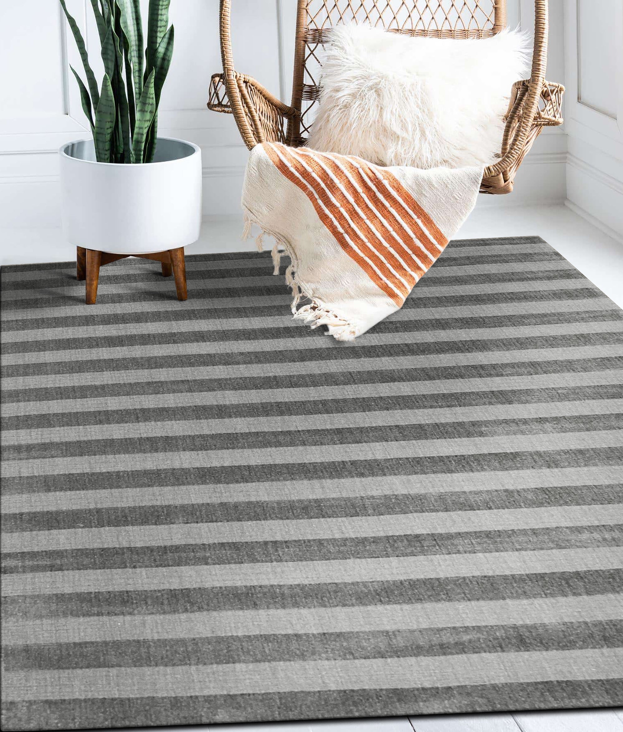 Yara Alluring Gray Handmade Wool Rug, soft gray tones and intricate patterns invite warmth and sophistication into a living space, hand-knotted for lasting quality.