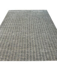 Delicate Giselle Gray Handmade Wool Rug, featuring a subtle pattern and soft texture, displayed in a bright, modern living space.