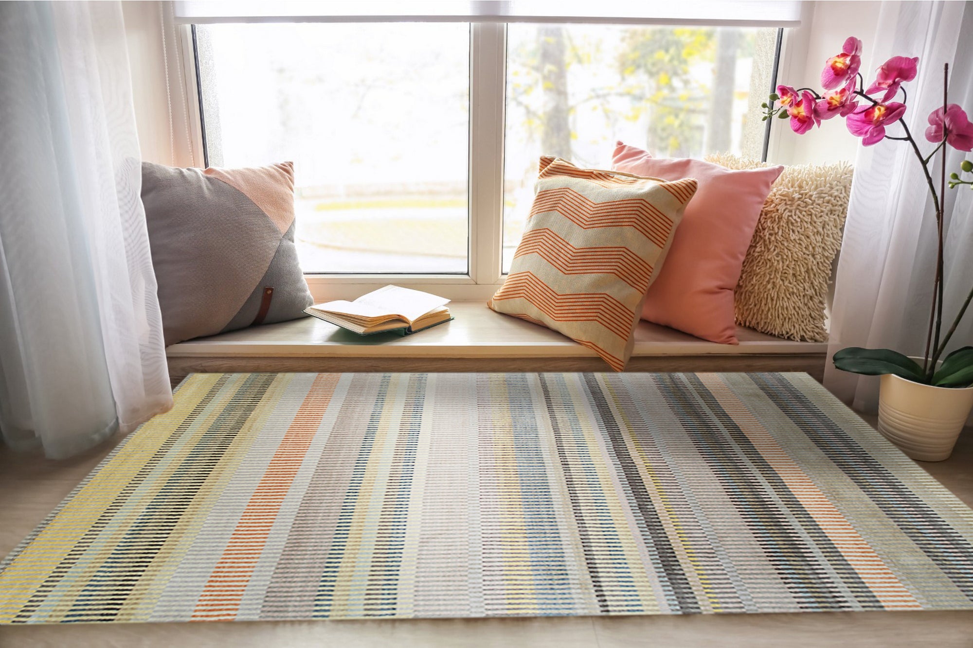 Louie Ophelia Beige Handmade Wool Rug graces a softly lit room, its intricate pattern adding subtle texture to the neutral décor. Warm beige tones and the rug's hand-knotted wool construction offer a luxurious feel underfoot.