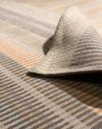 Louie Ophelia Beige Handmade Wool Rug, soft beige wool layers texture and subtle depth in a modern living room, offering comfort and warmth underfoot.