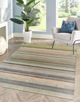 Louie Ophelia Beige Handmade Wool Rug, subtle geometric patterns dance across a soft beige field, hand-knotted wool offering both warmth and refined texture in a living room setting.