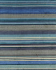 Isolated view of Louie Ophelia Ocean Blue Handmade Wool Rug, showcasing its intricate, swirling patterns in varying shades of blue and cream, evoking the depths of the ocean.