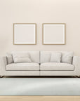 Willow Sarrah Ivory Handmade Wool Rug, a plush ivory wool rug with a subtle, textured design, complements a modern living space with neutral furniture and natural light.