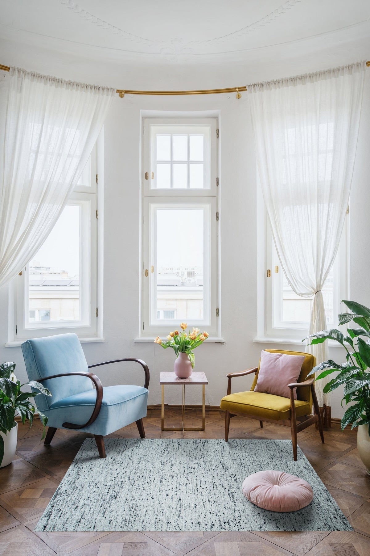 Opulent Alluring Dark Gray Handmade Wool Rug, its deep gray tones and hand-knotted wool construction adding sophistication to a light, airy living room with modern furniture.