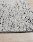Opulent Alluring Dark Gray Handmade Wool Rug, its rich dark gray tones and dense wool weave providing luxurious texture and warmth to a contemporary living space with neutral furniture.